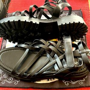 Size 9 straps NastyGal sandals in black.